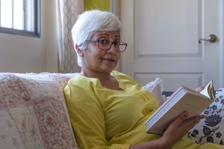 Diane De Courcy reading a book